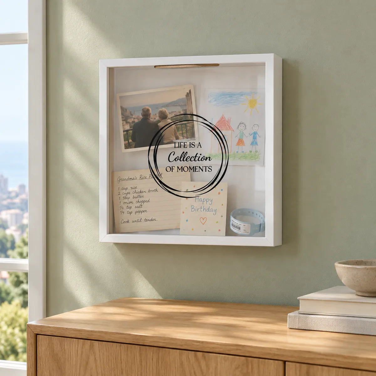 Moments Box with family memories on a sage wall